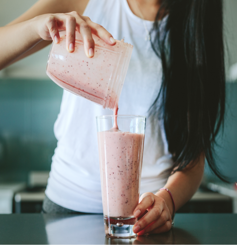 Woman pouring smoothie